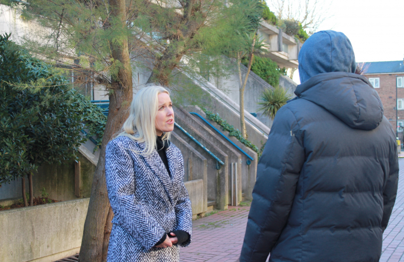 Julie speaking to a young man about his thoughts on crime